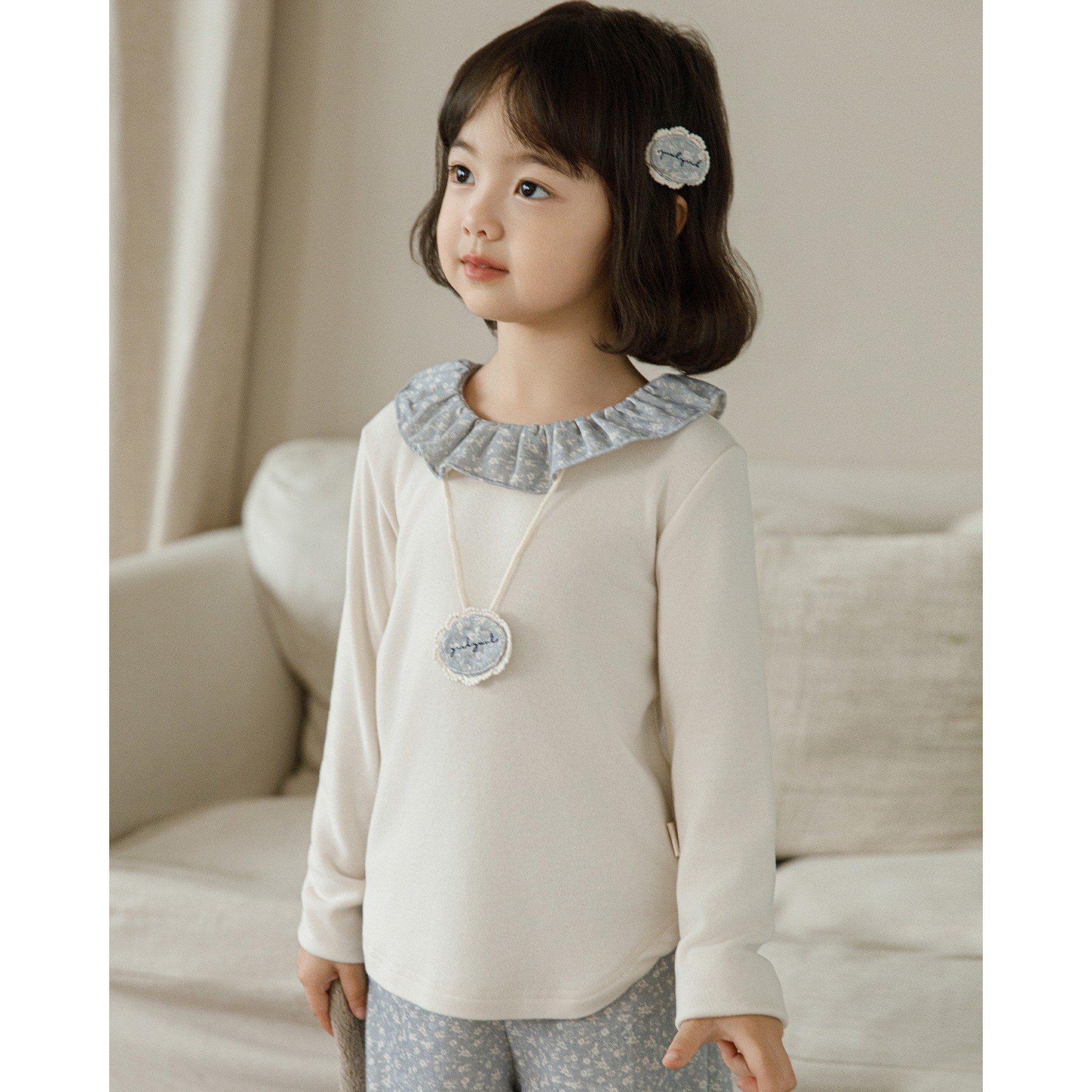 Floral Blouse With A Ruffled Neckline photo 2