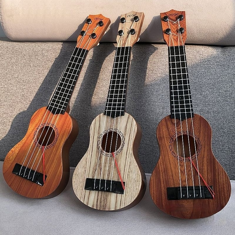 Ukulele Guitar Musical Instrument Toy photo 1